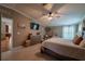 Well-lit main bedroom showcasing a king bed and view into the house at 13024 Mohican Ave, New Port Richey, FL 34654
