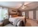 Inviting main bedroom with a king bed, natural light, and views to other rooms at 13024 Mohican Ave, New Port Richey, FL 34654