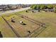 Aerial view of a fenced dog park within the community, providing a safe space for pets at 14466 English Lavender Dr, Wimauma, FL 33598