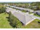 Scenic aerial view of a well-maintained residential neighborhood with mature trees at 18129 Baywood Forest Dr, Hudson, FL 34667
