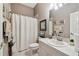 Functional bathroom featuring a shower and tub with a neutral color palette at 18129 Baywood Forest Dr, Hudson, FL 34667