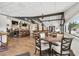 This spacious dining area has a wet bar, large tables, and chairs for dining at 18129 Baywood Forest Dr, Hudson, FL 34667