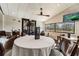 A bright dining room with large windows offers a comfortable and inviting space for meals at 18129 Baywood Forest Dr, Hudson, FL 34667