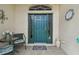 Stylish front door with sidelights and a decorative transom window, creating a welcoming entrance at 18129 Baywood Forest Dr, Hudson, FL 34667