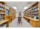 Quiet library lined with extensive bookshelves, providing a perfect space for reading and reflection at 18129 Baywood Forest Dr, Hudson, FL 34667