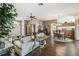 Bright and airy living room featuring an open floor plan and easy access to the dining area at 18129 Baywood Forest Dr, Hudson, FL 34667