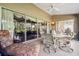 Charming patio featuring comfortable lounge seating and an outdoor dining area at 18129 Baywood Forest Dr, Hudson, FL 34667