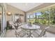 Relaxing screened patio with comfortable seating, perfect for outdoor enjoyment at 18129 Baywood Forest Dr, Hudson, FL 34667