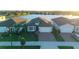 Beautiful single Gathering home showcasing a brick paved drive, meticulous landscaping, and tranquil waterfront views at 19742 Sea Glass Cir, Land O Lakes, FL 34638