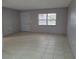 Bright living room with neutral walls and tile flooring at 2628 Wildwood Ln, Palm Harbor, FL 34684