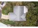 An aerial view of the roof, trees, driveway and backyard at 2641 Royal Ridge Dr, Spring Hill, FL 34606