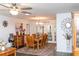 Elegant dining area featuring a wooden dining set, decorative rug, and ample natural light from the adjoining room at 2641 Royal Ridge Dr, Spring Hill, FL 34606