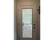 Elegant front door featuring decorative glass, adding a touch of sophistication and style to the home's entrance at 2641 Royal Ridge Dr, Spring Hill, FL 34606