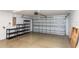 A spacious garage with a white door, shelving and ample room for parking and storage at 2641 Royal Ridge Dr, Spring Hill, FL 34606