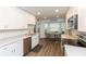 Bright kitchen features white cabinets, stainless appliances, breakfast nook, and lots of natural light at 2641 Royal Ridge Dr, Spring Hill, FL 34606