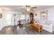 Bright and airy living room with modern flooring, comfortable seating, and natural light from the bay window at 2641 Royal Ridge Dr, Spring Hill, FL 34606