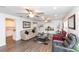Spacious living room with hardwood floors, recessed lighting, ceiling fans, and comfortable seating at 2641 Royal Ridge Dr, Spring Hill, FL 34606