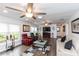 Open living room with hardwood floors, recessed lighting, ceiling fans, and neutral furniture at 2641 Royal Ridge Dr, Spring Hill, FL 34606