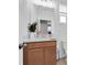 Charming bathroom with a wood vanity, white sink, and decorative accents for a relaxing ambiance at 2830 Dudley Ave, Odessa, FL 33556
