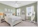 Inviting bedroom with ample natural light, neutral decor and a comfortable bed offers a peaceful retreat at 2830 Dudley Ave, Odessa, FL 33556