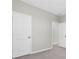 Bedroom featuring neutral walls, white trim, and doorways leading to other rooms in the home at 2830 Dudley Ave, Odessa, FL 33556