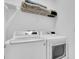 Efficient laundry room featuring modern, front-load washer and dryer with shelving for organized storage at 2830 Dudley Ave, Odessa, FL 33556