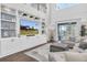 Open-concept living room featuring a built-in entertainment center and backyard access at 2830 Dudley Ave, Odessa, FL 33556