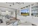 Spacious open-concept living room with a view to the kitchen and built-in entertainment center at 2830 Dudley Ave, Odessa, FL 33556