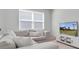 Comfortable living room with sofa, television, and a bright window creates a relaxing atmosphere at 2830 Dudley Ave, Odessa, FL 33556