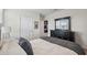 Cozy bedroom featuring a comfortable bed and dresser at 30845 Penny Surf Loop, Wesley Chapel, FL 33545