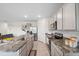 Spacious kitchen with grey cabinets, granite counters, stainless appliances, and open layout at 30845 Penny Surf Loop, Wesley Chapel, FL 33545