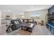 Spacious living room adjacent to the kitchen and dining area, perfect for entertaining and Gathering gatherings at 30845 Penny Surf Loop, Wesley Chapel, FL 33545