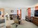 Inviting living room with neutral carpeting, traditional seating, and plentiful light at 3632 Pensdale Dr, New Port Richey, FL 34652