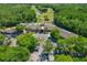 Aerial view of the community center, showcasing its location near a golf course and lush landscaping at 370 Tall Oak Trl, Tarpon Springs, FL 34688
