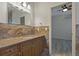 Bathroom with granite counters and tile backsplash at 370 Tall Oak Trl, Tarpon Springs, FL 34688