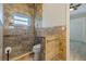 Bathroom featuring beautiful stone shower, granite counter and glass door at 370 Tall Oak Trl, Tarpon Springs, FL 34688