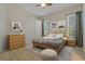 Cozy bedroom with wood look floors, neutral tones, and plenty of natural light at 370 Tall Oak Trl, Tarpon Springs, FL 34688