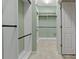 Walk-in closet with rods and shelving for ample storage at 370 Tall Oak Trl, Tarpon Springs, FL 34688