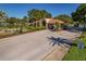 Paved entry to the gated community with water feature and mature landscaping at 370 Tall Oak Trl, Tarpon Springs, FL 34688