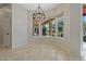 Bright dining area features a large window with a view to the patio at 370 Tall Oak Trl, Tarpon Springs, FL 34688