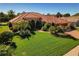 Stunning exterior elevation of a single-Gathering home with lush landscaping, a tile roof, and a well-manicured lawn at 370 Tall Oak Trl, Tarpon Springs, FL 34688