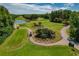 Scenic golf course with manicured greens, mature trees, and water features at 370 Tall Oak Trl, Tarpon Springs, FL 34688