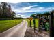 Lush golf course fairway with course marker in a picturesque community setting at 370 Tall Oak Trl, Tarpon Springs, FL 34688