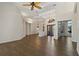 Open-concept living room featuring beautiful wood floors, double doors and soaring ceilings at 370 Tall Oak Trl, Tarpon Springs, FL 34688