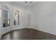 The office features tile floors, built-in shelving, and lots of light from the windows at 370 Tall Oak Trl, Tarpon Springs, FL 34688