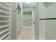 Spacious walk-in closet with custom shelving and ample storage space, perfect for organizing your wardrobe at 370 Tall Oak Trl, Tarpon Springs, FL 34688
