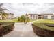 Condo complex exterior surrounded by landscaping and sidewalks throughout the community at 4712 Marine Pkwy # 104, New Port Richey, FL 34652