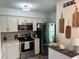 Well-equipped kitchen with stainless appliances, light cabinetry, and decor at 4925 Myrtle Oak Dr # 22, New Port Richey, FL 34653