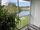 Scenic view from screened patio, showcasing lush greenery and a tranquil waterway at 4925 Myrtle Oak Dr # 22, New Port Richey, FL 34653