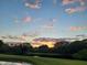 Picturesque sunset view over the serene lake and lush trees, showcasing the community's beauty at 4925 Myrtle Oak Dr # 22, New Port Richey, FL 34653
